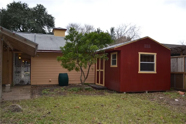 a view of a tree in a yard