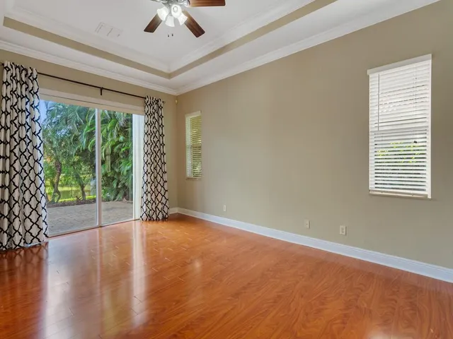 a view of an entryway with wooden floor