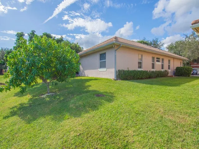 a view of a backyard with potted plants