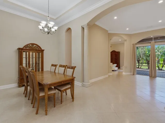 a kitchen with stainless steel appliances granite countertop a sink and a refrigerator