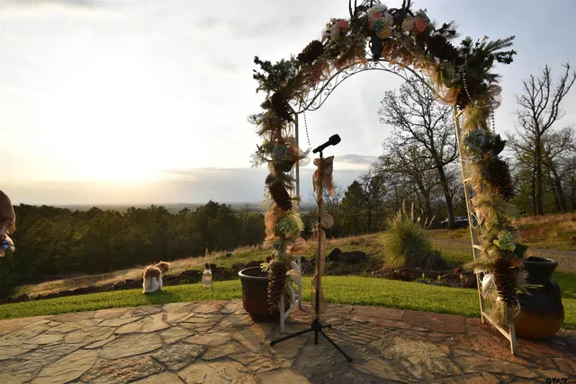 a view of a lake with couches chairs
