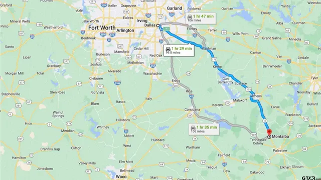 a view of a lake with lawn chairs and a table