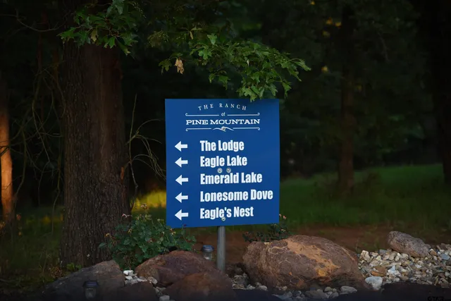 a outdoor living space with patio furniture and a fireplace