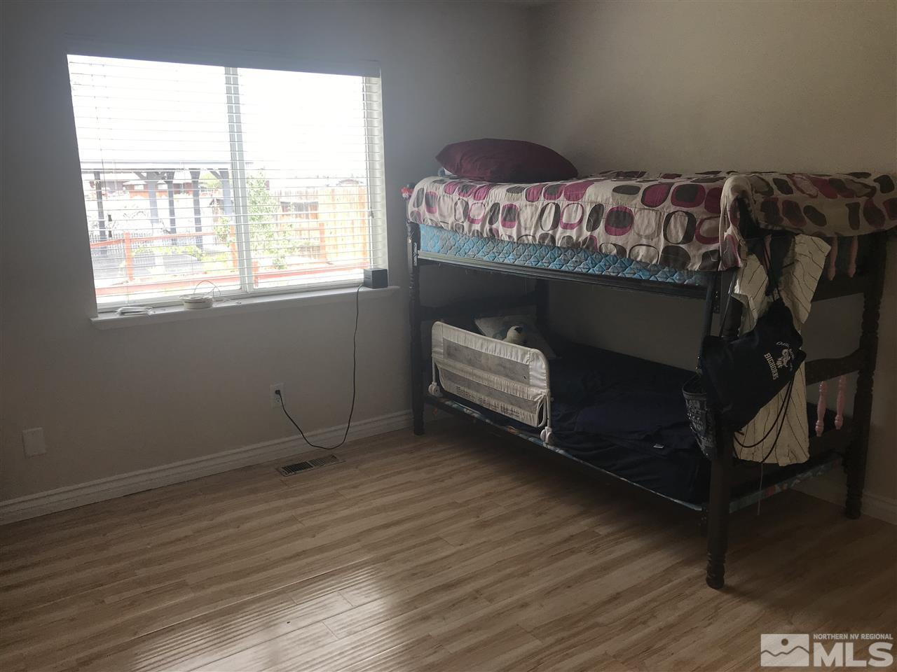 1820 Rice Road Fallon, NV 89406 - Photo 13 of 17 a bed room with a bed and a window