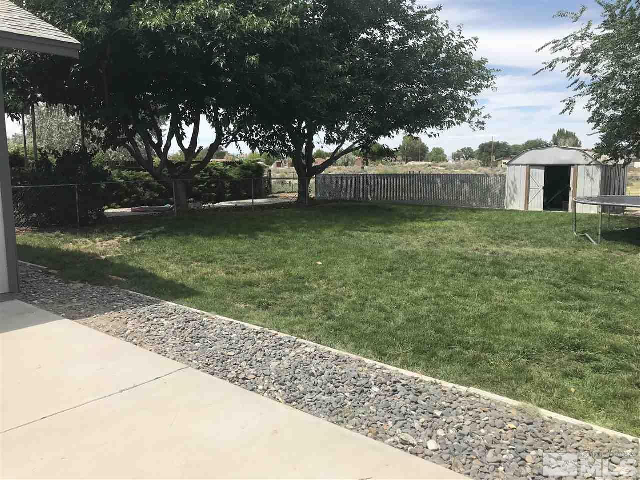 1820 Rice Road Fallon, NV 89406 - Photo 4 of 17 a backyard of a house with lots of green space