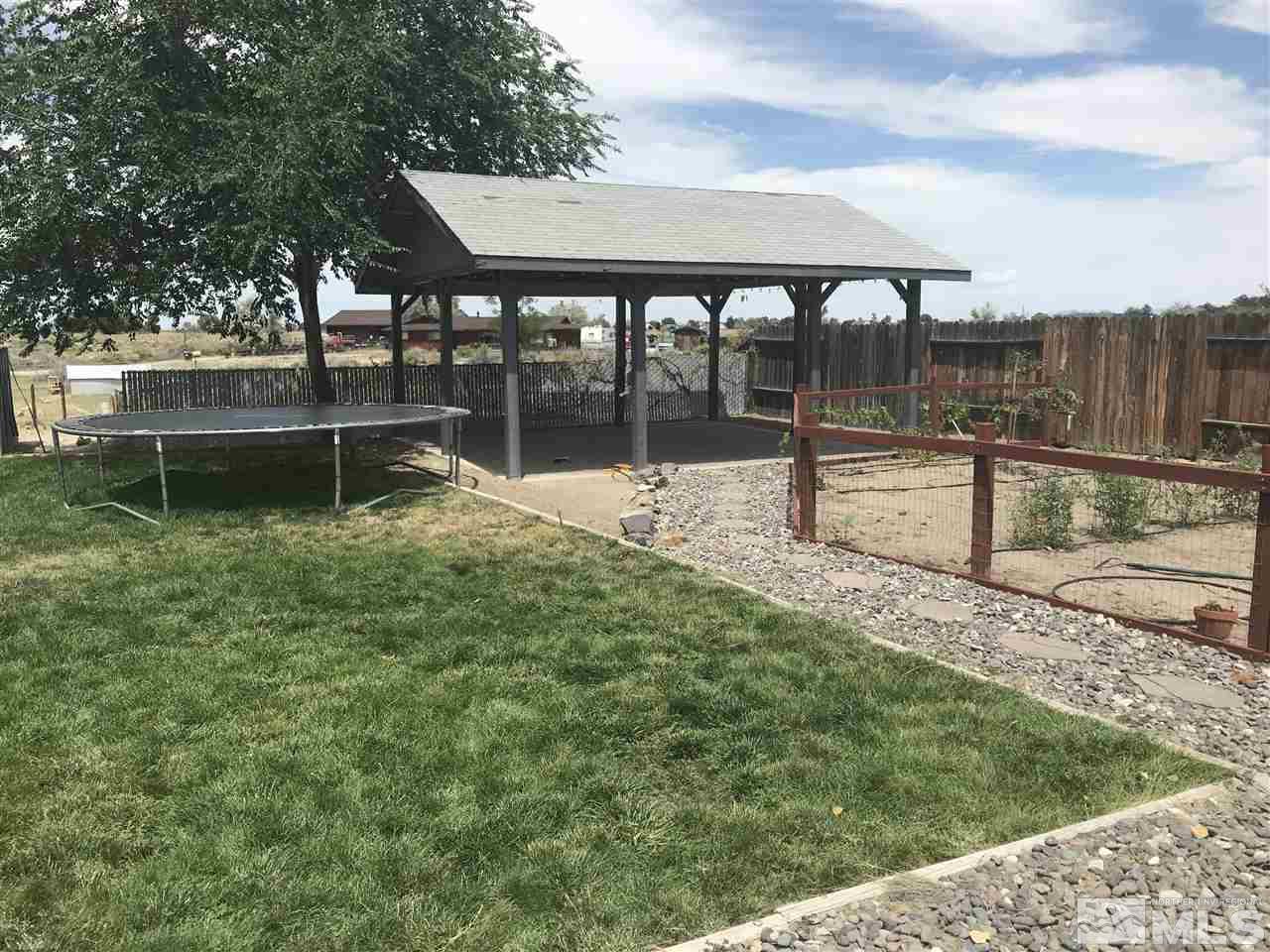 1820 Rice Road Fallon, NV 89406 - Photo 5 of 17 a backyard of a house with lots of green space