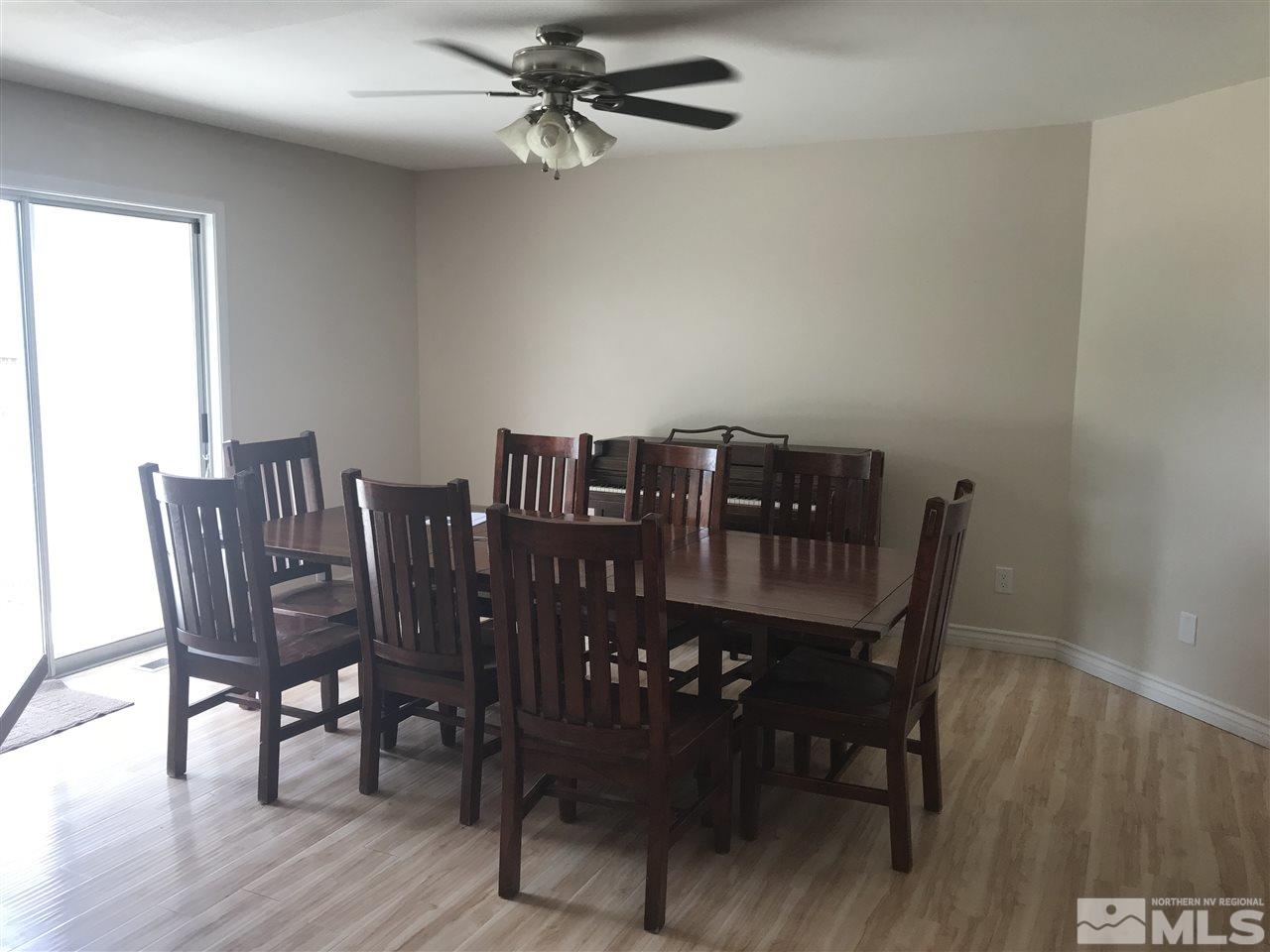 1820 Rice Road Fallon, NV 89406 - Photo 8 of 17 a view of a dining room with furniture and wooden floor