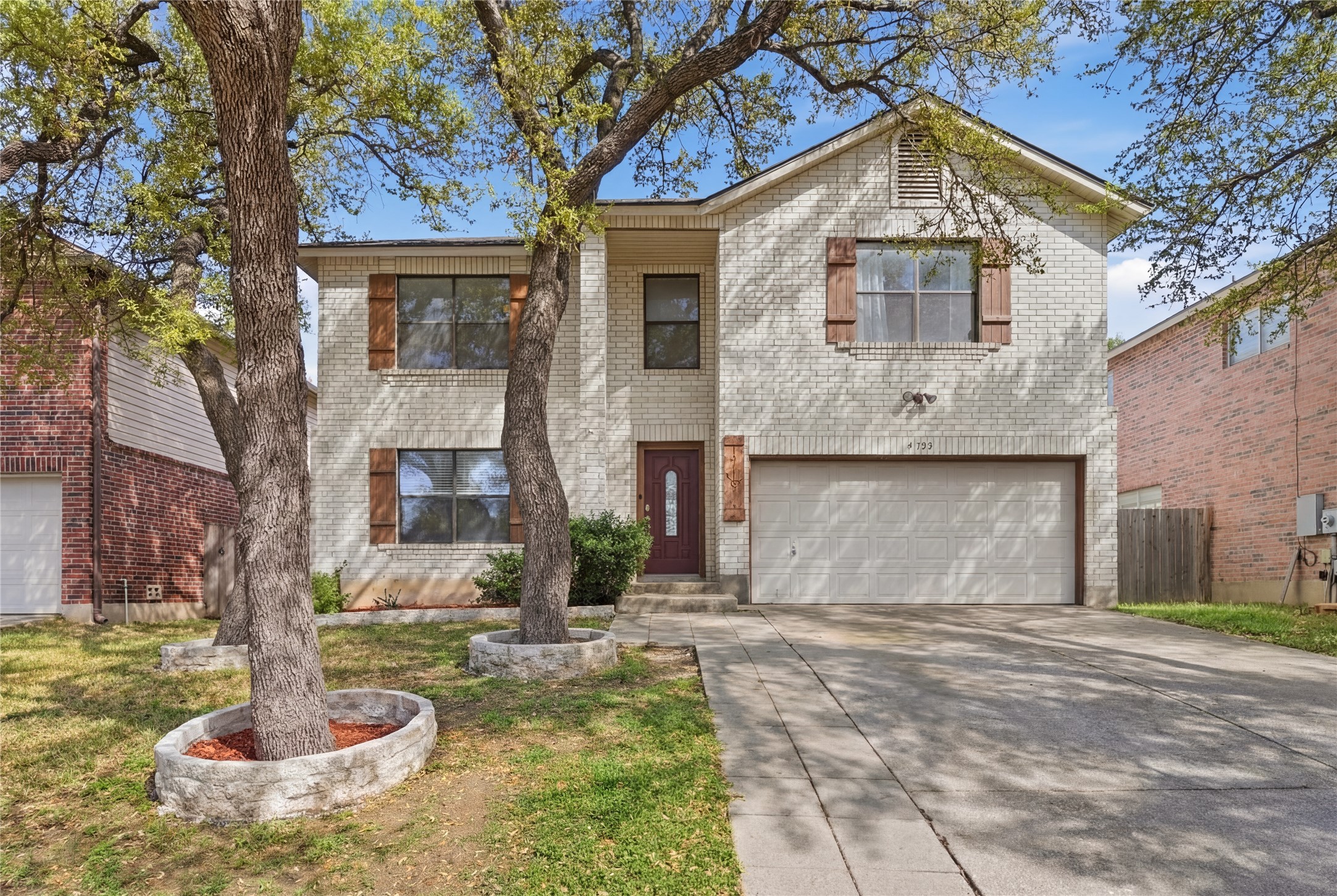 1715 Ruthie Run Cedar Park, TX 78613 - Photo 1 of 25 View of front of property with a garage, brick siding, and concrete driveway