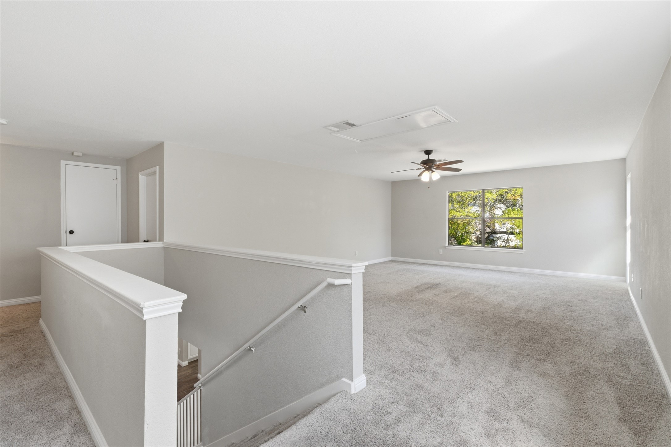 1715 Ruthie Run Cedar Park, TX 78613 - Photo 11 of 25 Carpeted living area featuring a ceiling fan. Can be used as game room, or additional family room.