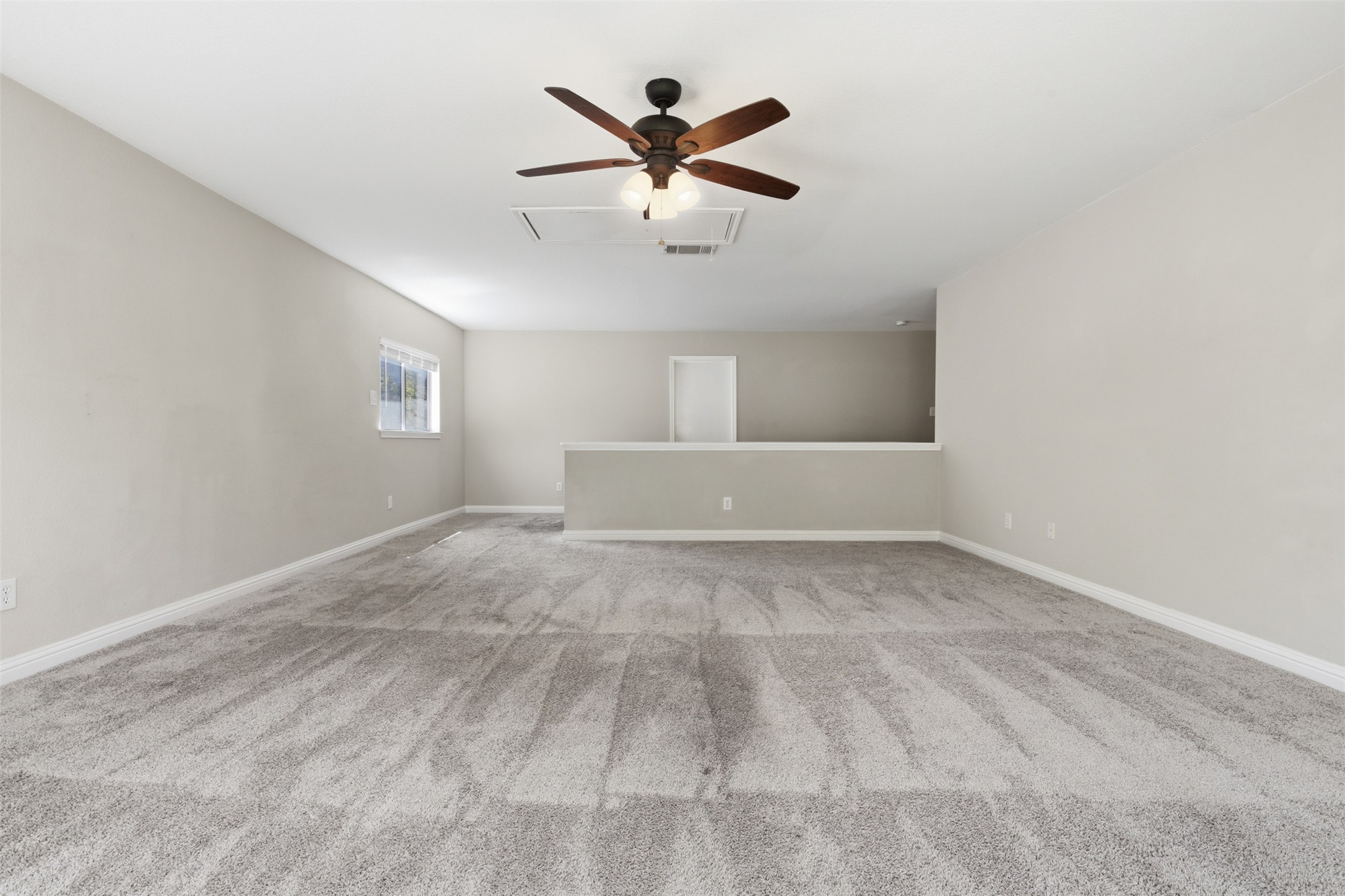1715 Ruthie Run Cedar Park, TX 78613 - Photo 13 of 25 Carpeted living area featuring a ceiling fan. Can be used as game room, or additional family room.