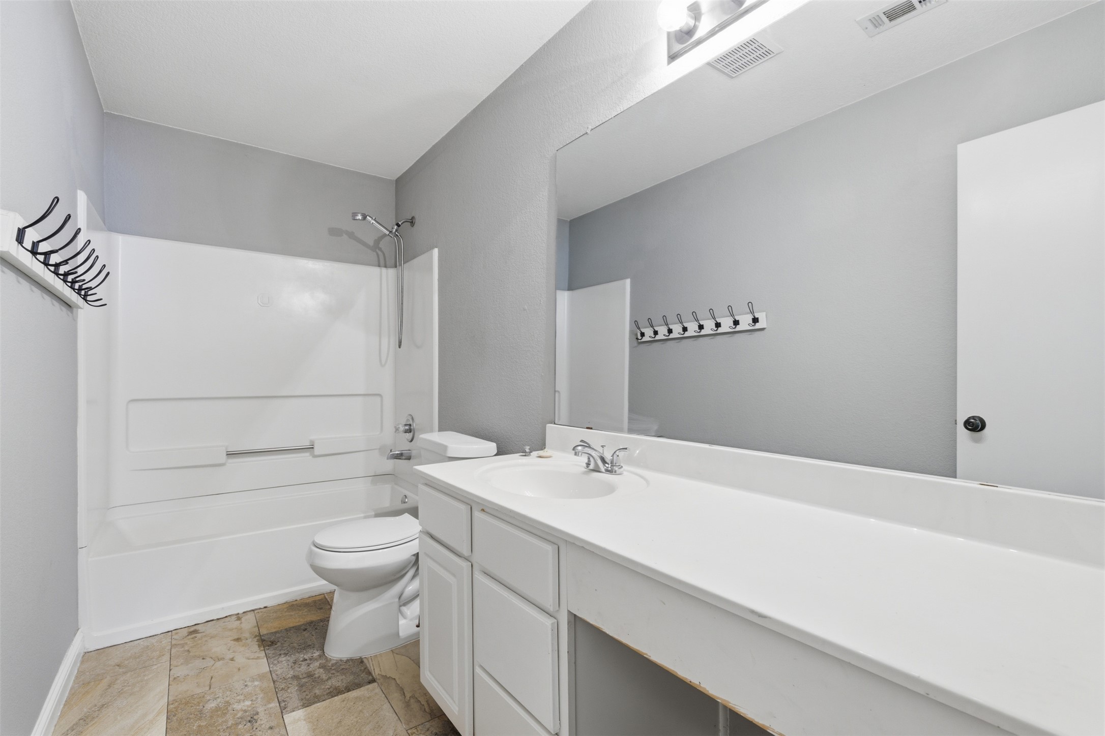 1715 Ruthie Run Cedar Park, TX 78613 - Photo 22 of 25 Bathroom with vanity and tub / shower combination