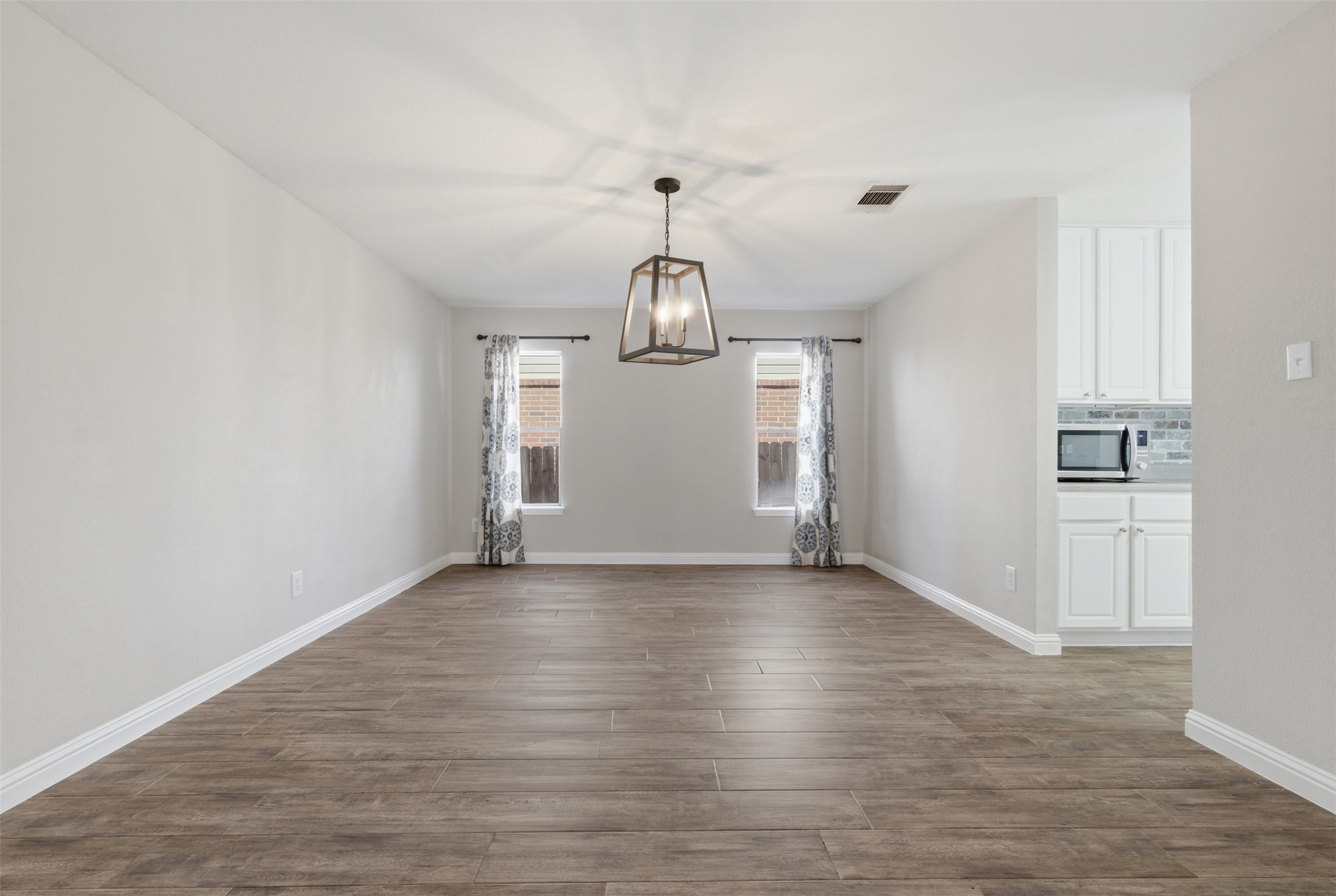 1715 Ruthie Run Cedar Park, TX 78613 - Photo 5 of 25 Dining Area open to the foyer. Lots of natural light and a chandalier.