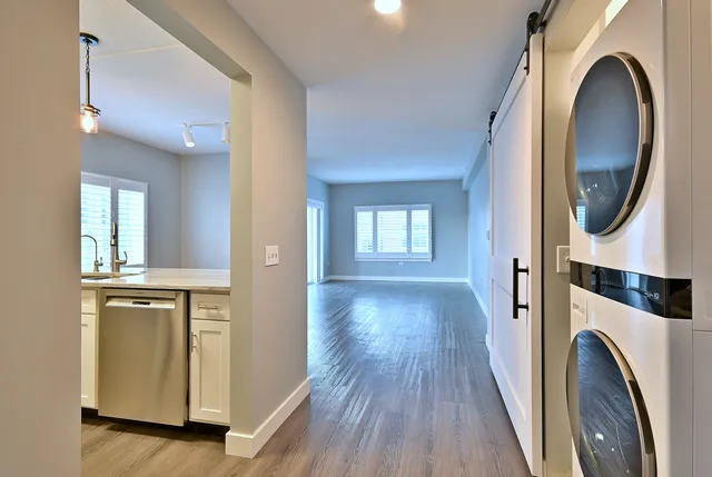 a view of a hallway with washer and dryer