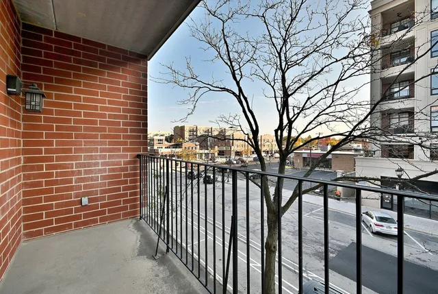 a view of a brick building from a bench