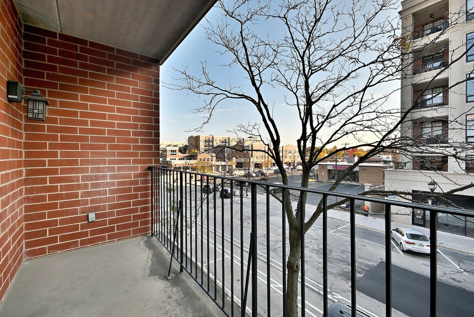 210 North Addison Avenue, Unit 303 Elmhurst, IL 60126 - Photo 18 of 20 a view of a brick building from a bench