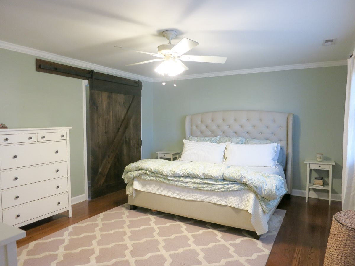 912 Hardimont Road Raleigh, NC 27609 - Photo 18 of 25 This view of the big Master Bedroom shows the dark wood barn door to the lg fitted (Elfa) WIC. Master Bedroom
