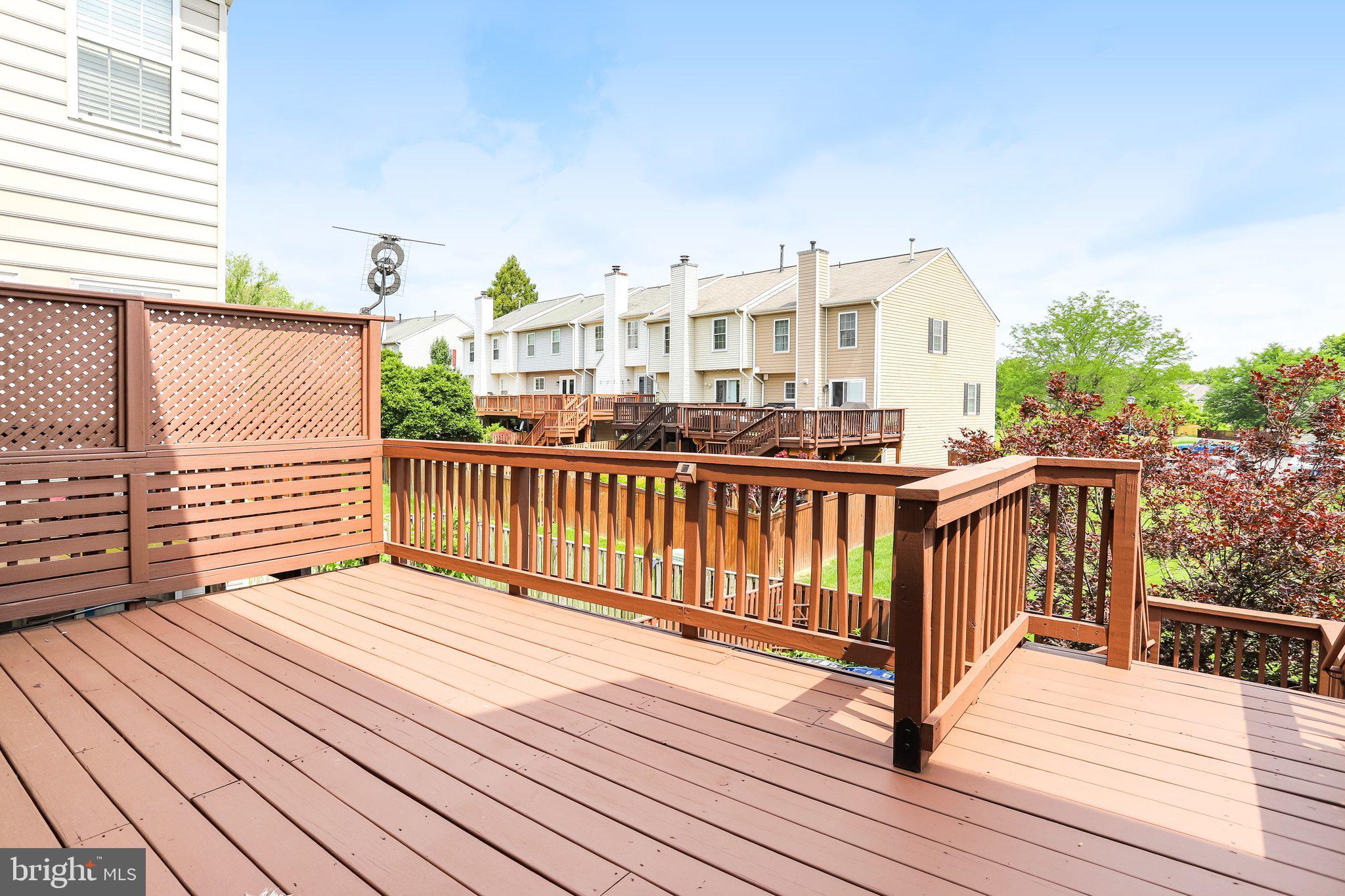 122 Goldsworth Terrace Southwest Leesburg, VA 20175 - Photo 8 of 31 Refinished Deck with Steps into the backyard
