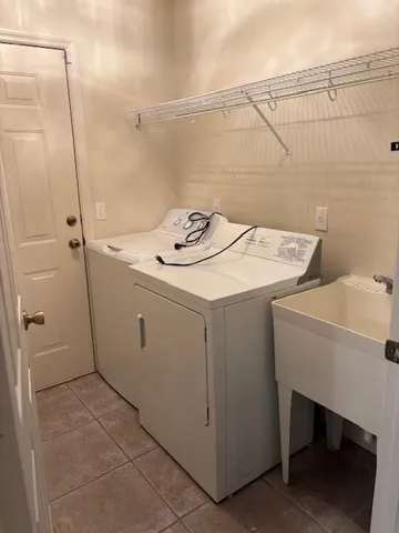 a view of a house with pool and chairs