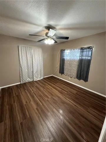 a view of a livingroom with wooden floor