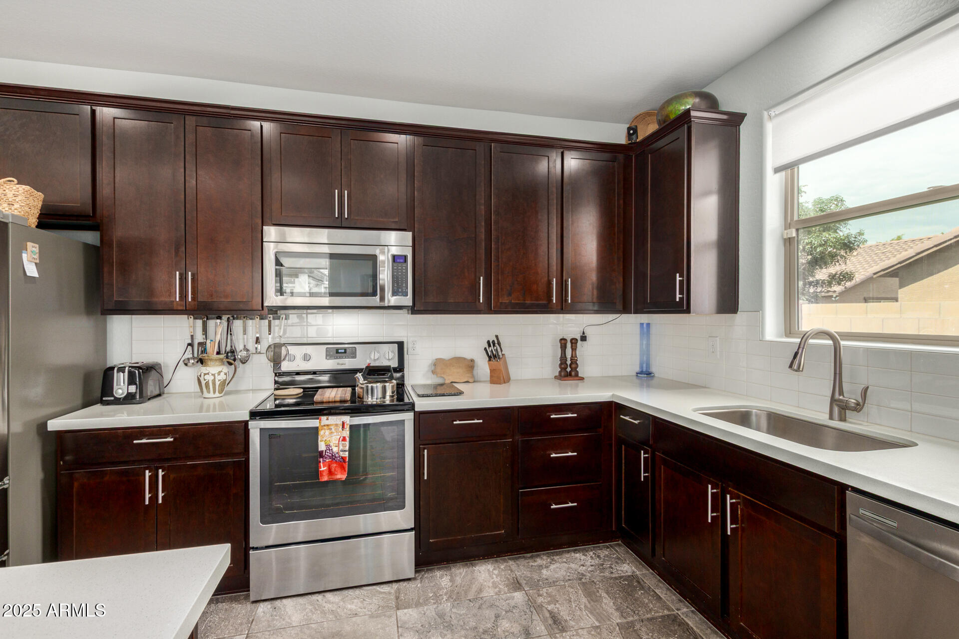 3440 North Mayfair Mesa, AZ 85213 - Photo 12 of 31 a kitchen with a sink and a stove top oven