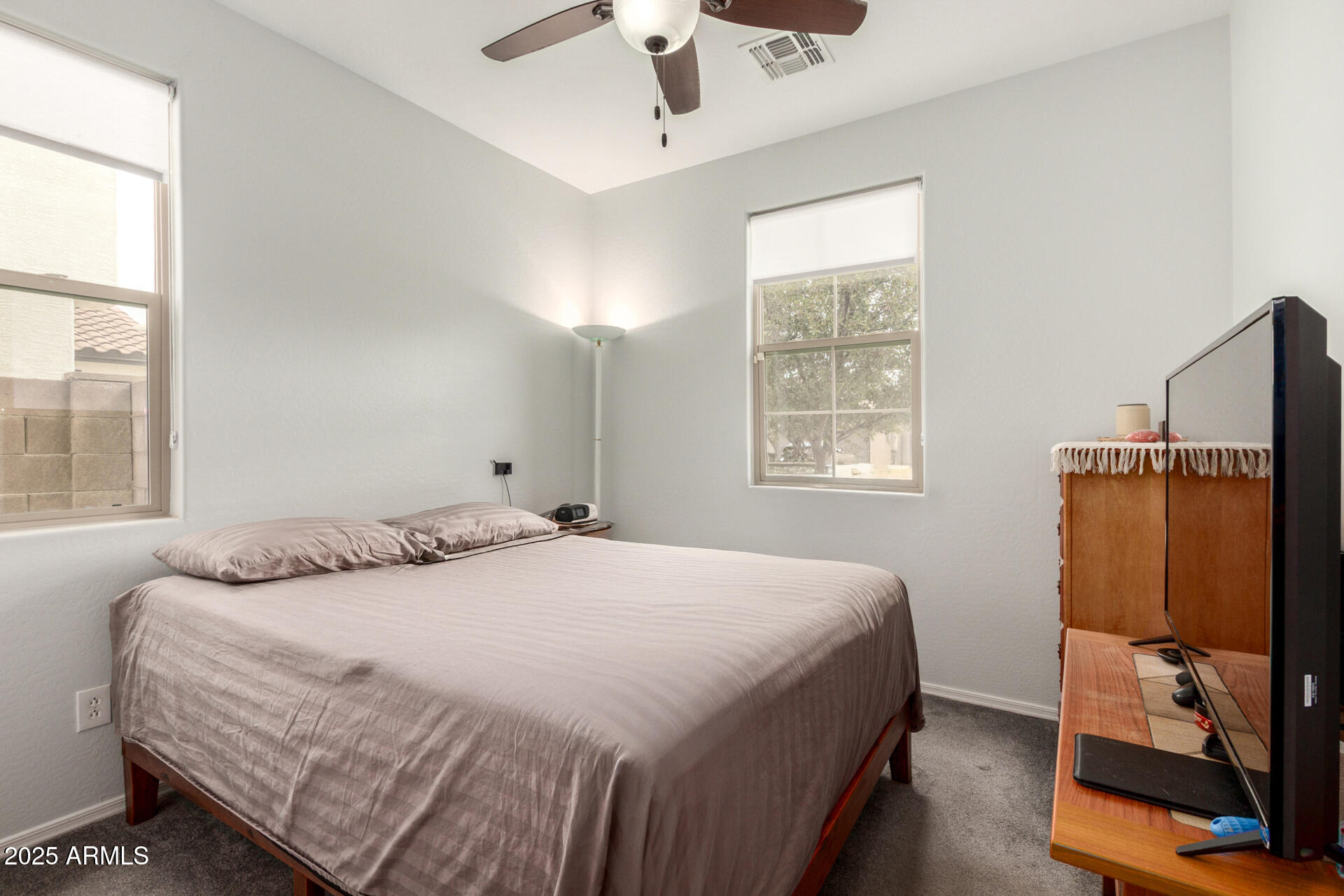 3440 North Mayfair Mesa, AZ 85213 - Photo 21 of 31 a bedroom with a bed closet and flat tv screen
