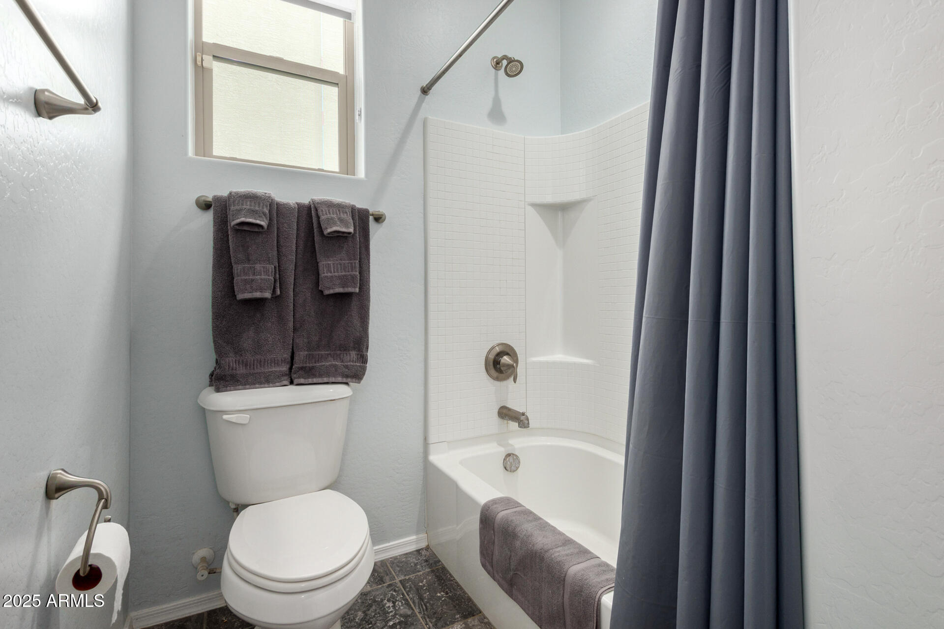 3440 North Mayfair Mesa, AZ 85213 - Photo 24 of 31 a white toilet sitting next to a bathroom sink