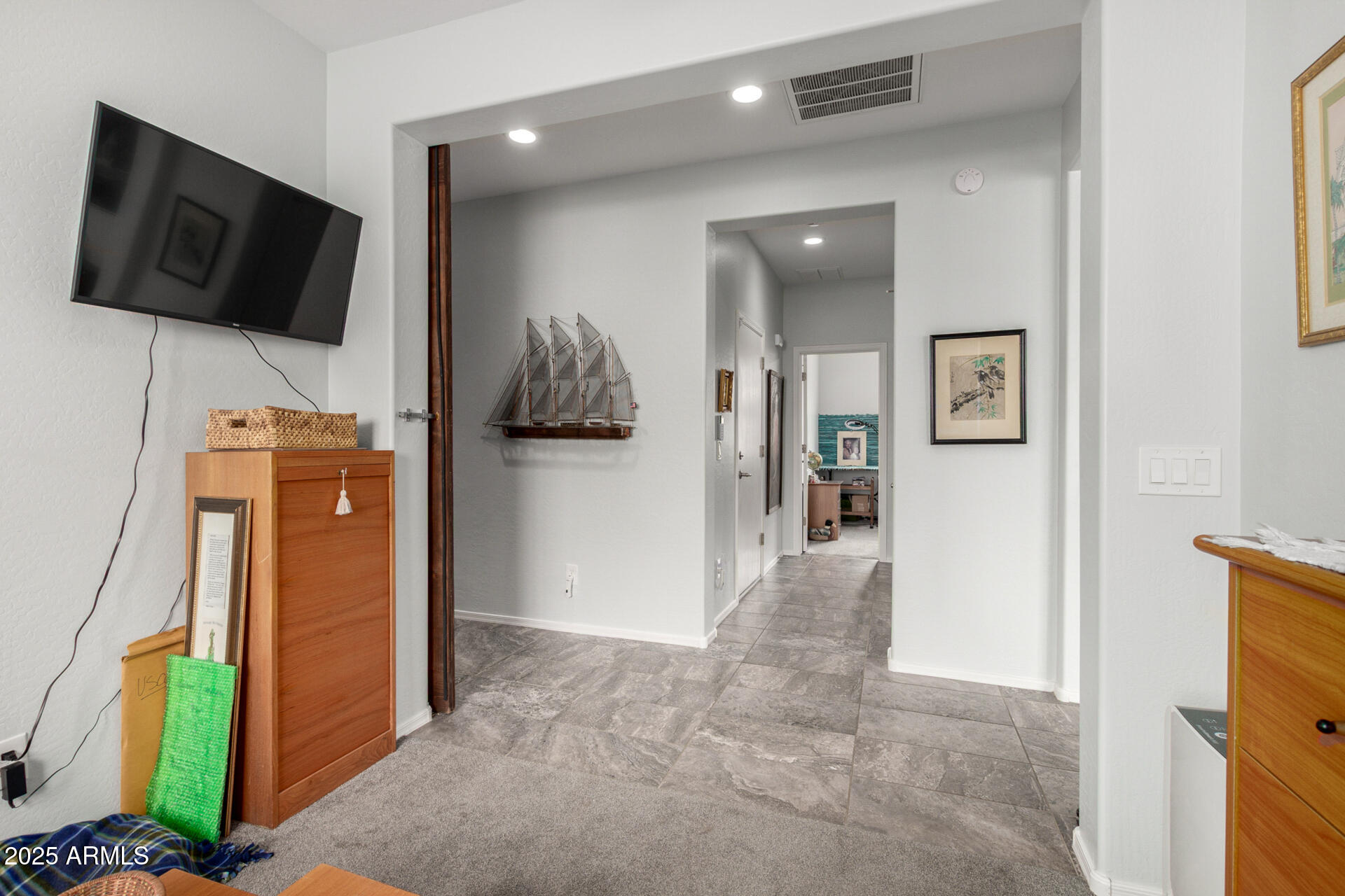 3440 North Mayfair Mesa, AZ 85213 - Photo 26 of 31 a view of a livingroom with wooden floor and a flat screen tv