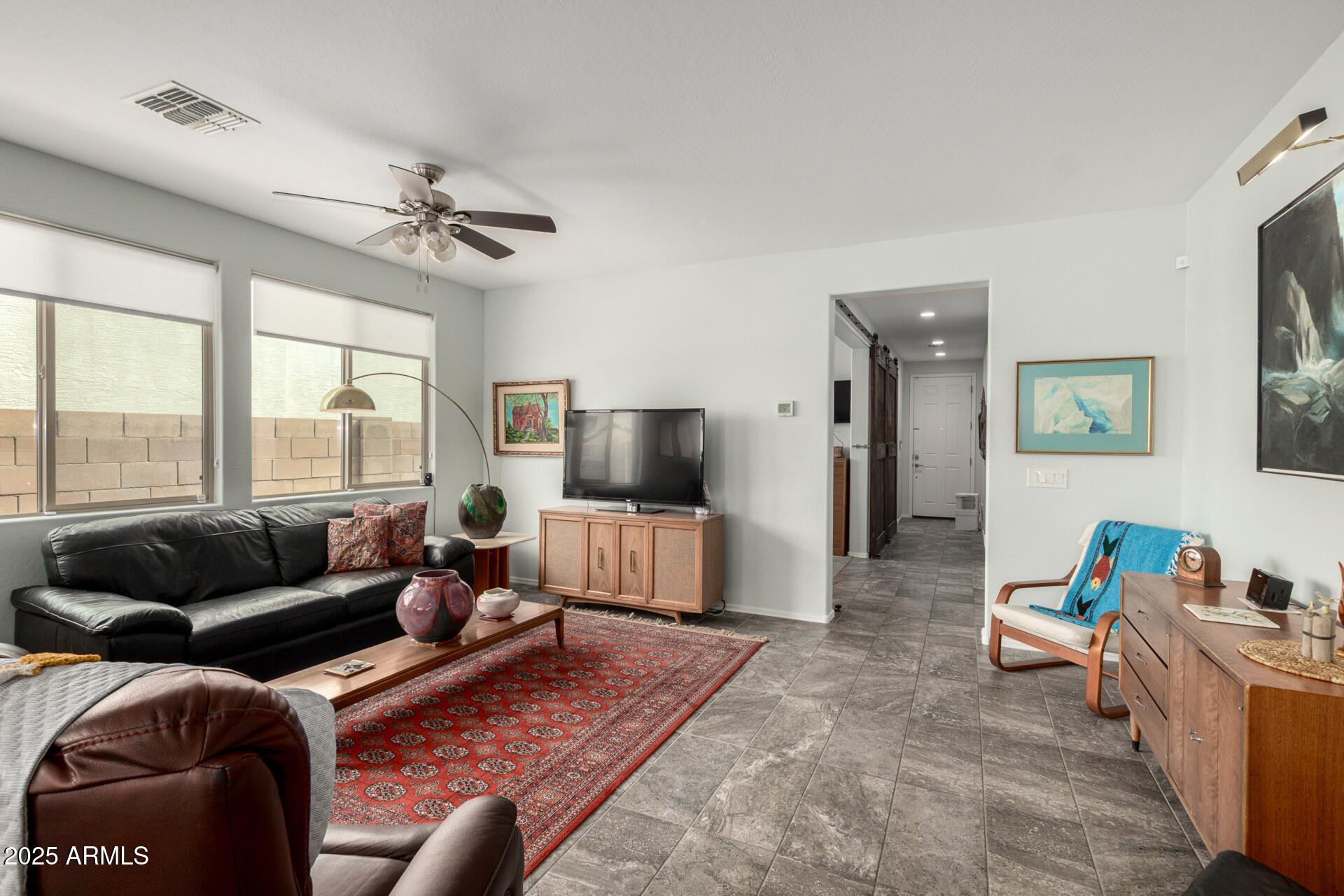 3440 North Mayfair Mesa, AZ 85213 - Photo 4 of 31 a living room with furniture and a flat screen tv
