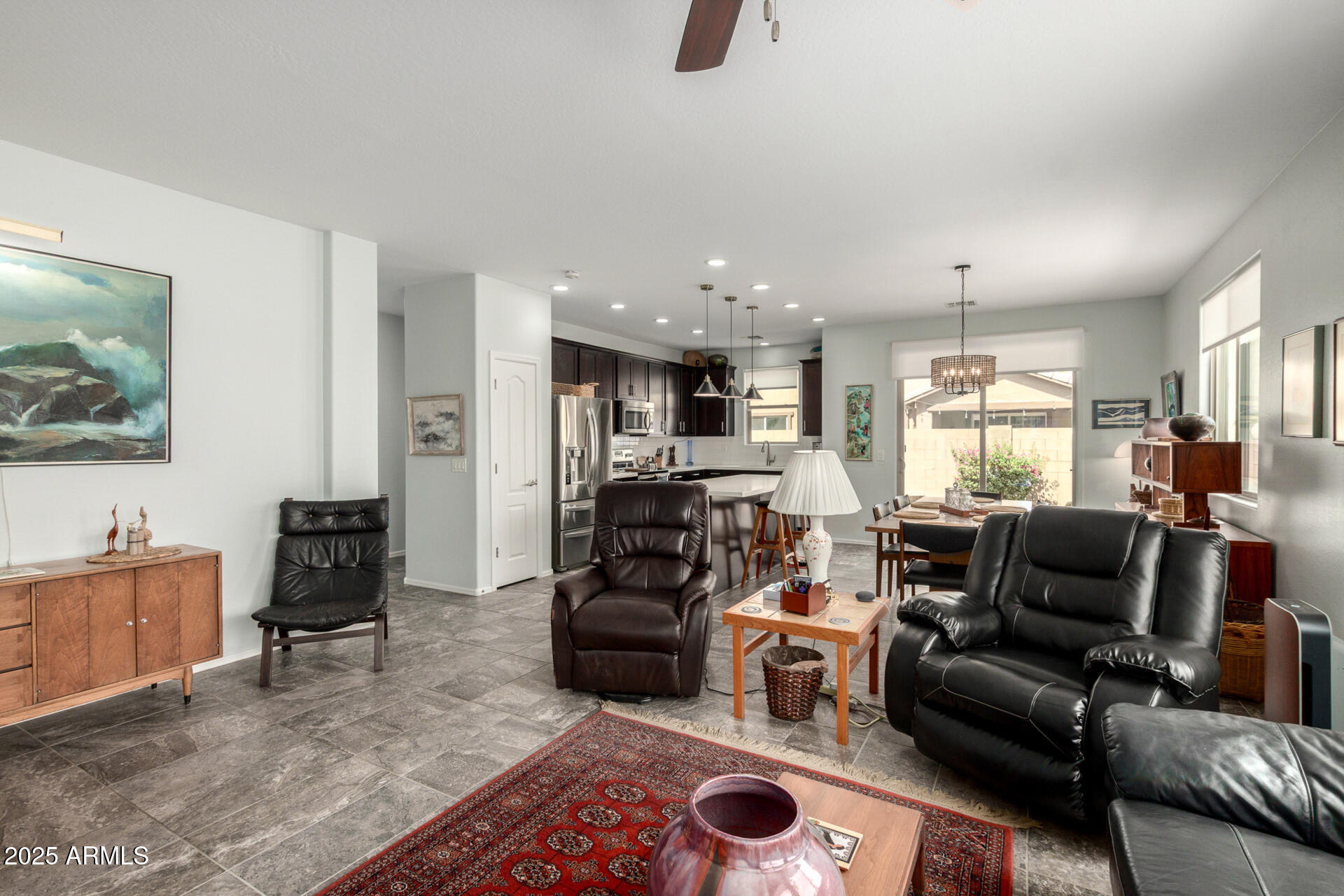 3440 North Mayfair Mesa, AZ 85213 - Photo 7 of 31 a living room with furniture and a flat screen tv