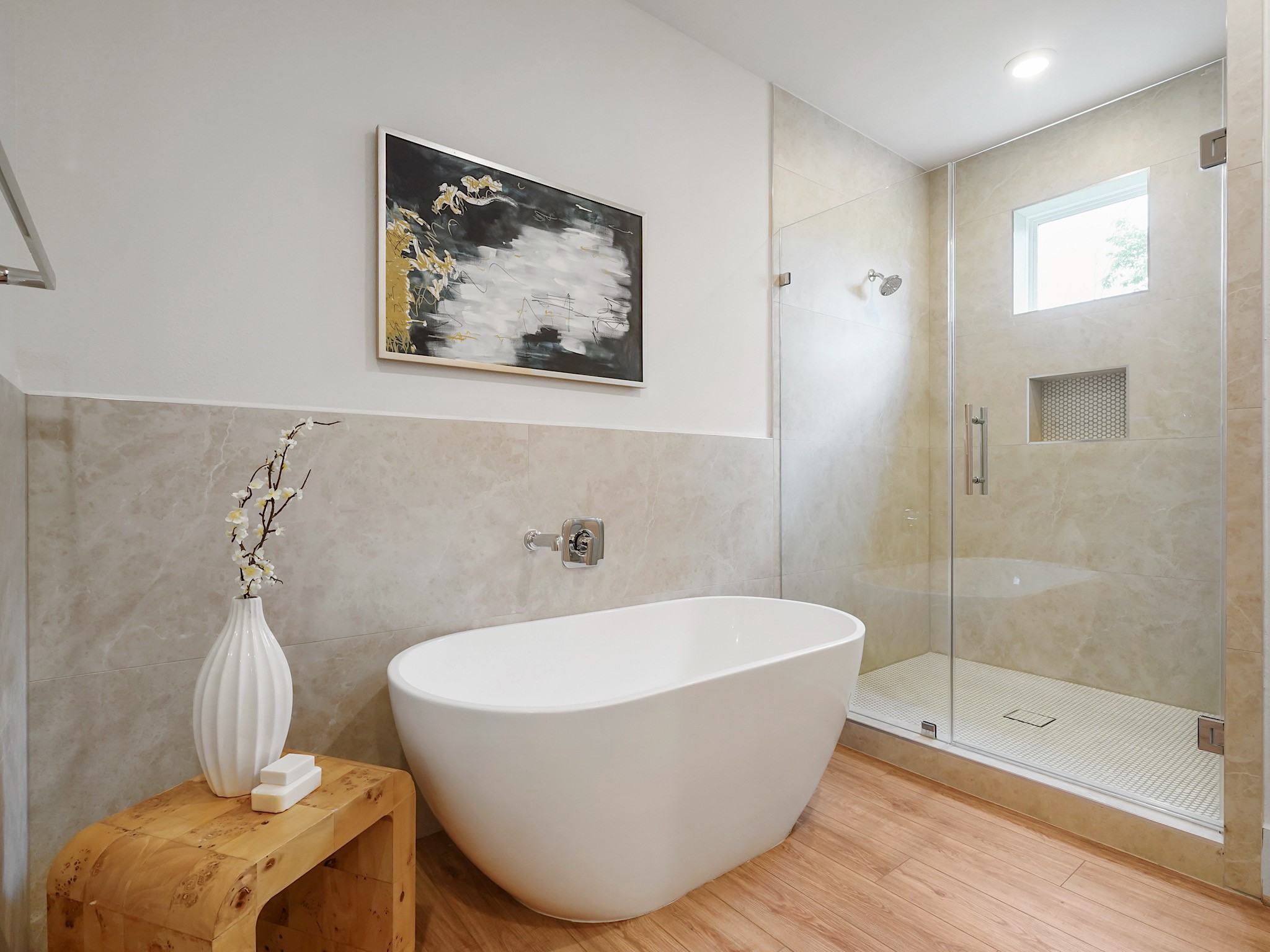 861 Rachel Street, Unit E Houston, TX 77091 - Photo 15 of 29 Experience pure tranquility in this sleek, stand-alone tub, offering a serene Zen ambiance for ultimate relaxation.