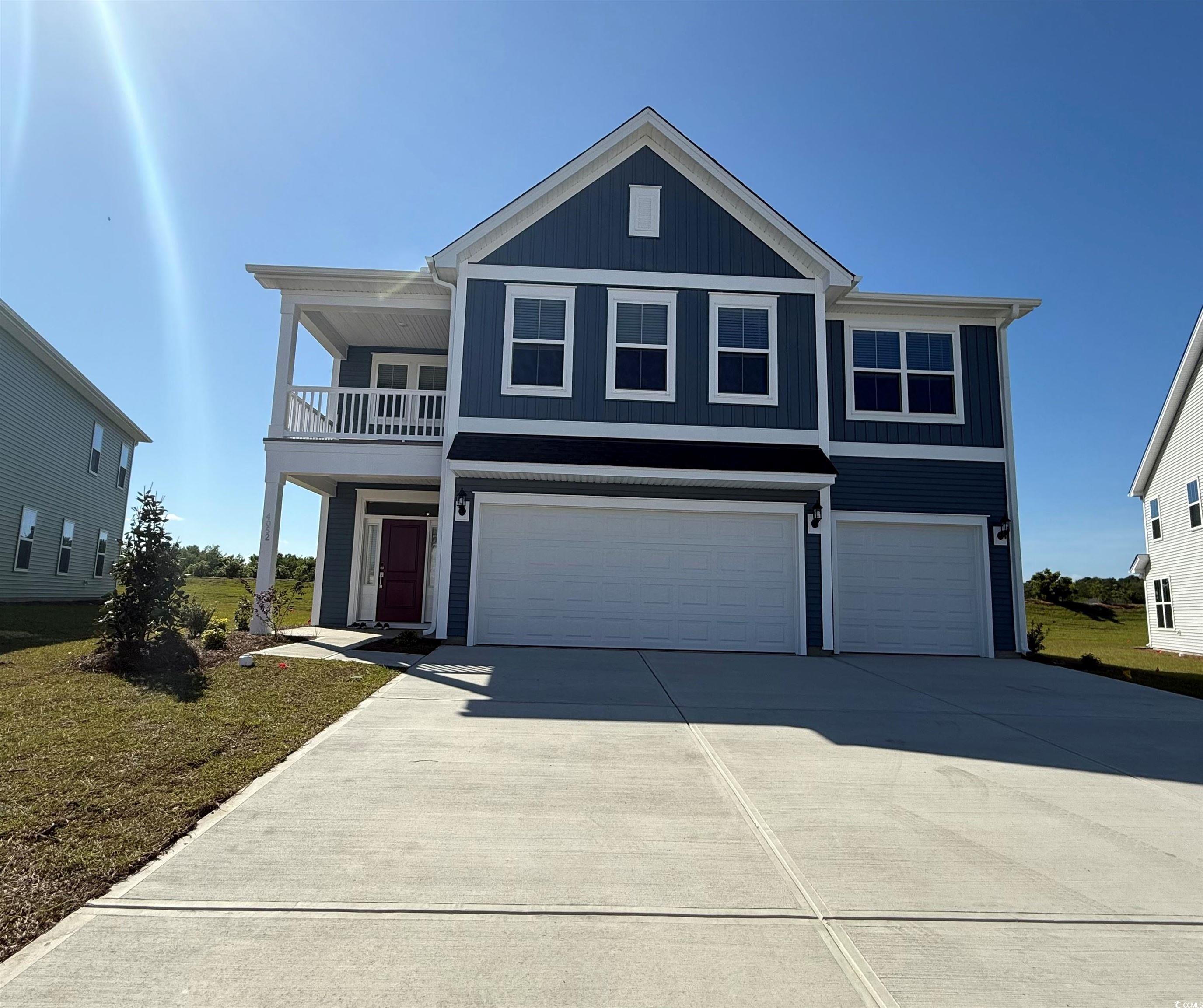 4052 Bucolic Loop Myrtle Beach, SC 29588 - Photo 1 of 31 View of front of home with an attached garage, dri