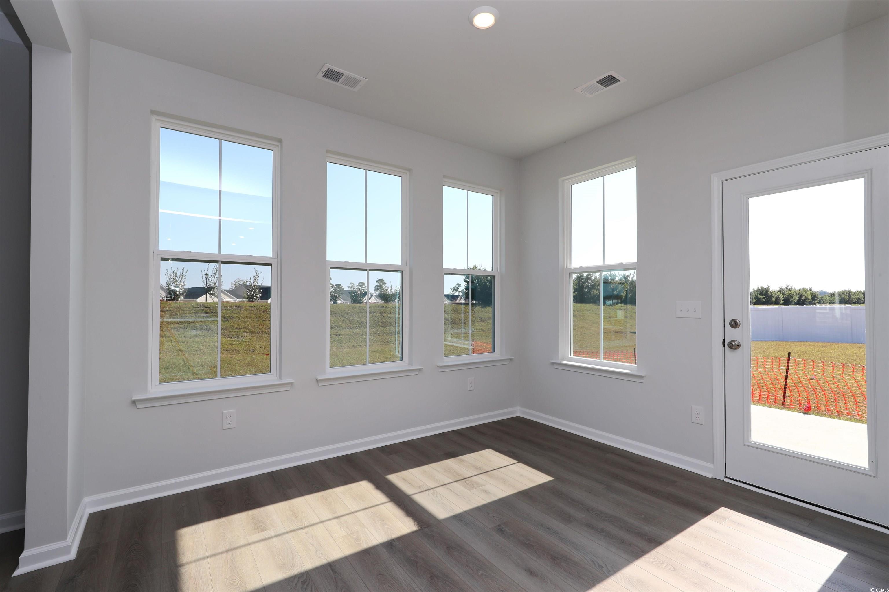 4052 Bucolic Loop Myrtle Beach, SC 29588 - Photo 4 of 31 Unfurnished sunroom featuring plenty of natural li