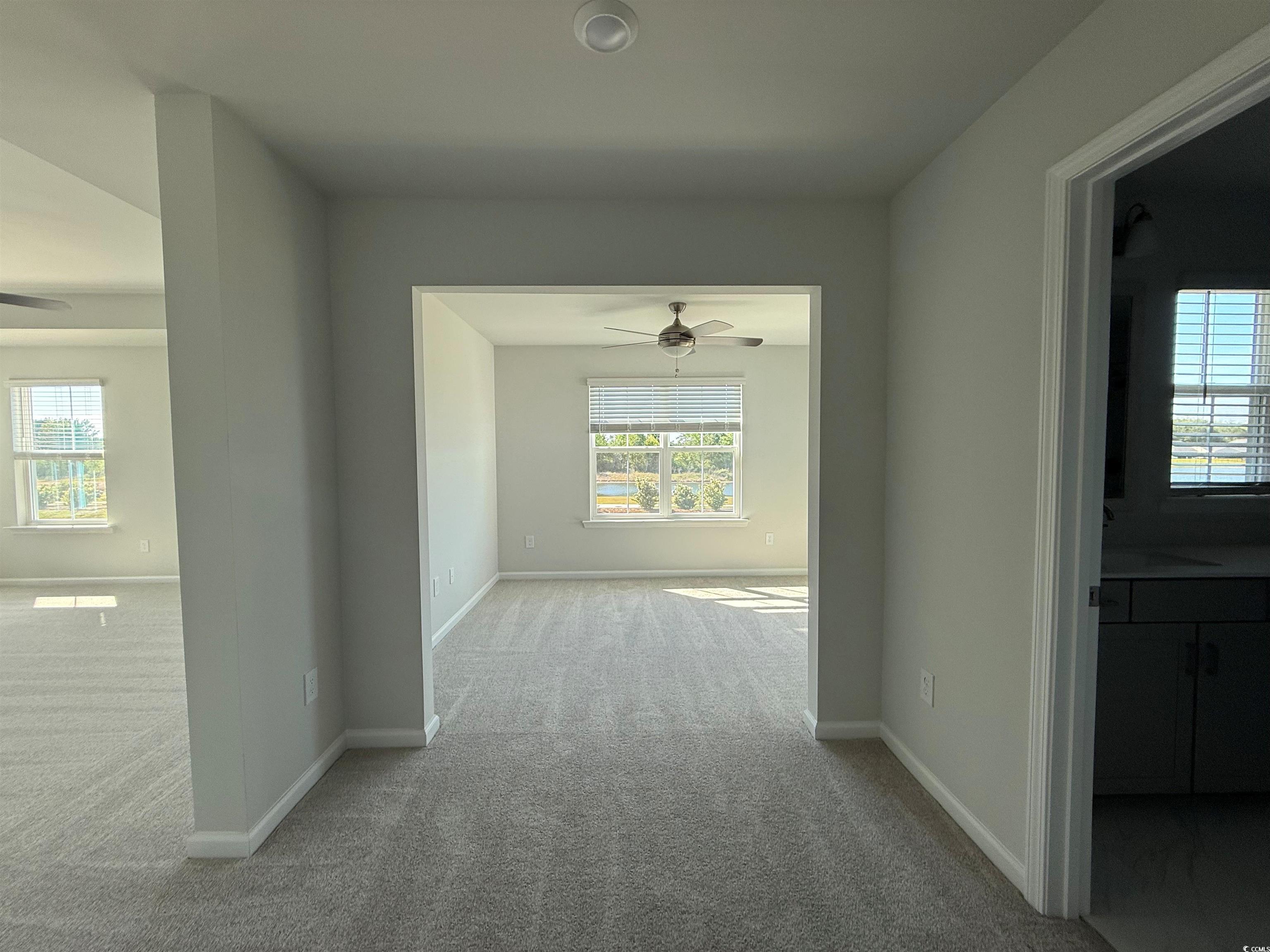 4052 Bucolic Loop Myrtle Beach, SC 29588 - Photo 5 of 31 Corridor featuring baseboards and carpet