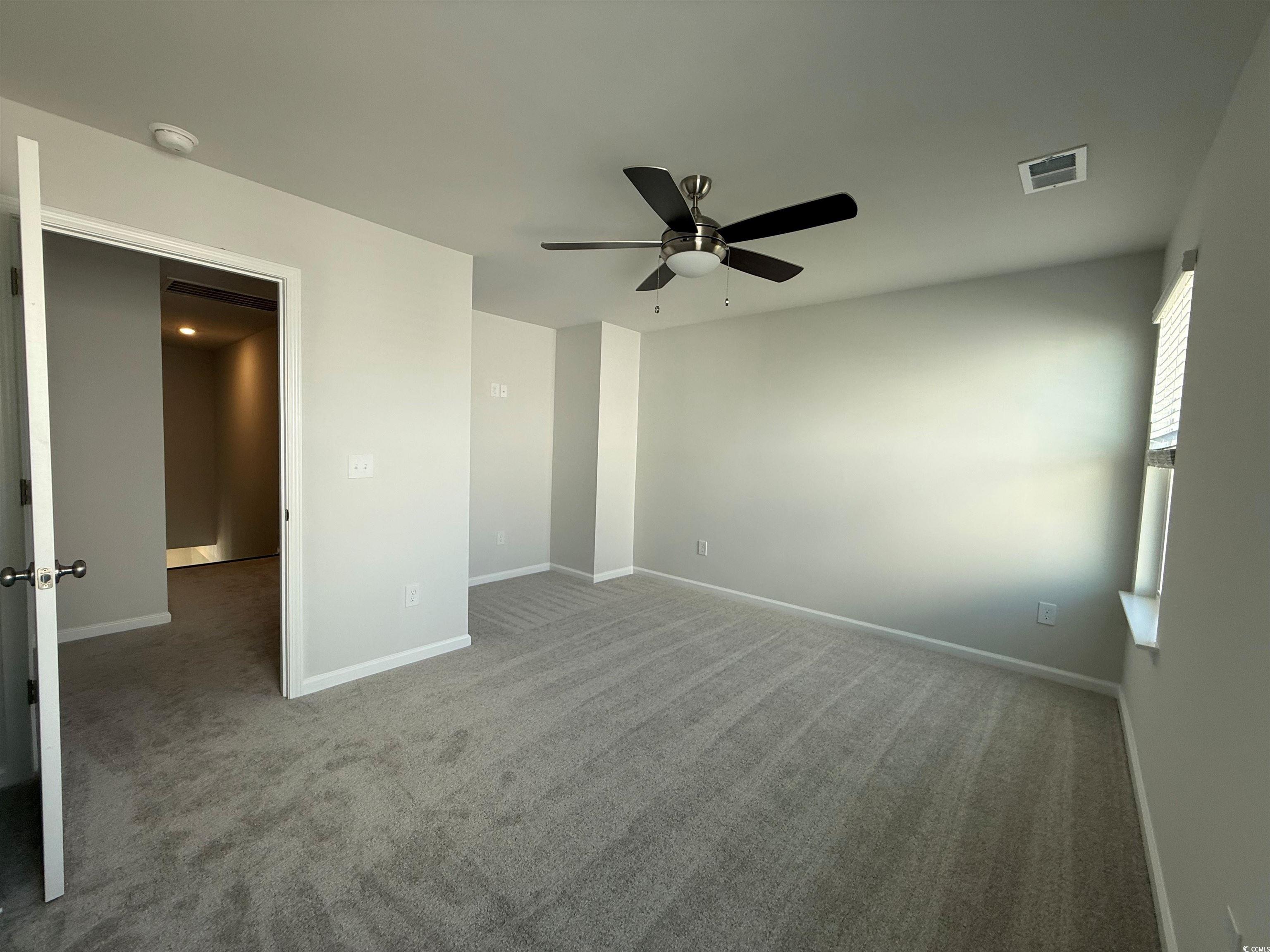 4052 Bucolic Loop Myrtle Beach, SC 29588 - Photo 6 of 31 Unfurnished bedroom featuring baseboards, ceiling