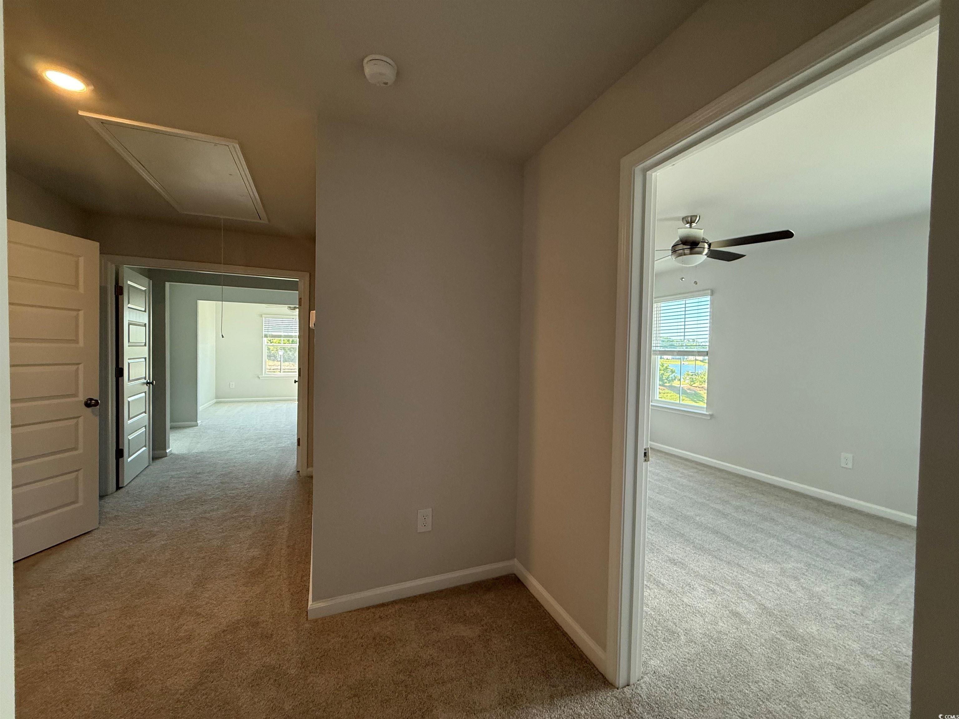 4052 Bucolic Loop Myrtle Beach, SC 29588 - Photo 7 of 31 Hall with baseboards, carpet, and attic access