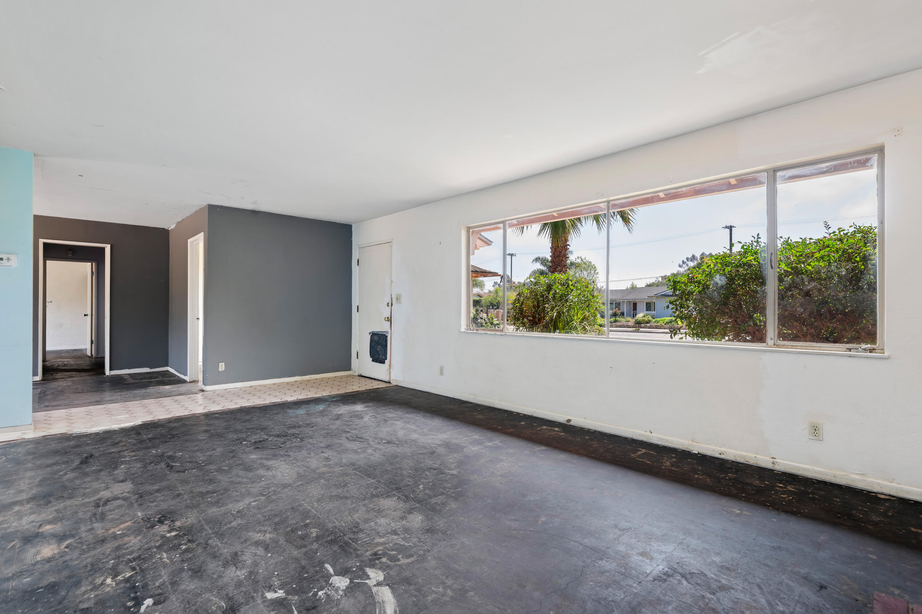 6242 Guava Avenue Goleta, CA 93117 - Photo 4 of 19 a view of an empty room with wooden floor and a window