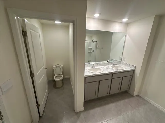 an empty room with wooden floor