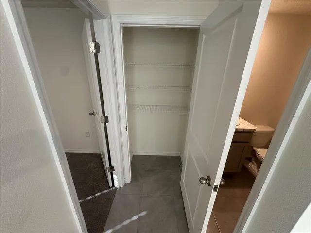 an entryway and a floor to ceiling window