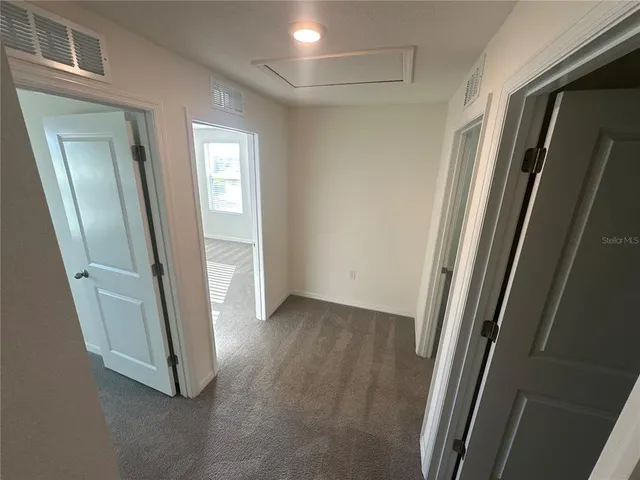 a view of an empty room and window