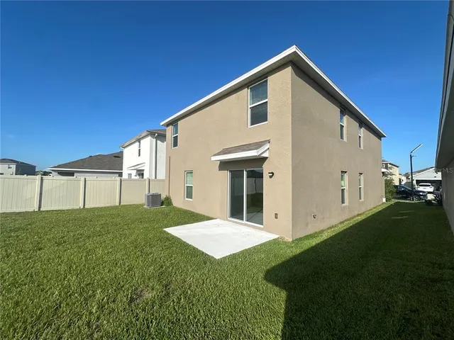 a front view of a house with a big yard