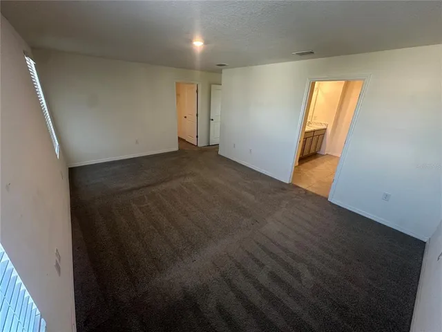 a view of empty room with windows