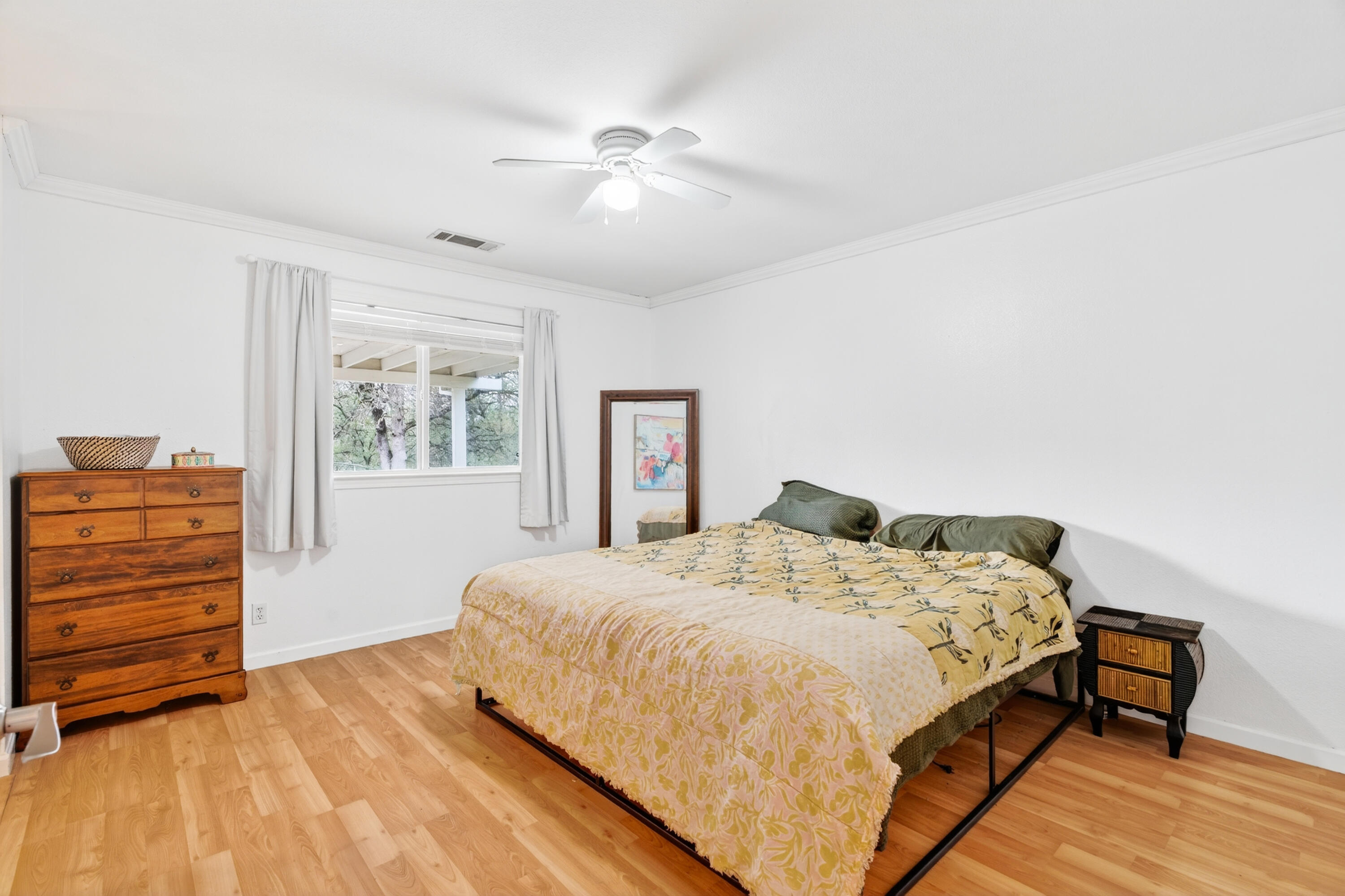 40 Ortega Court Redding, CA 96003 - Photo 14 of 29 a bedroom with a bed and a dresser