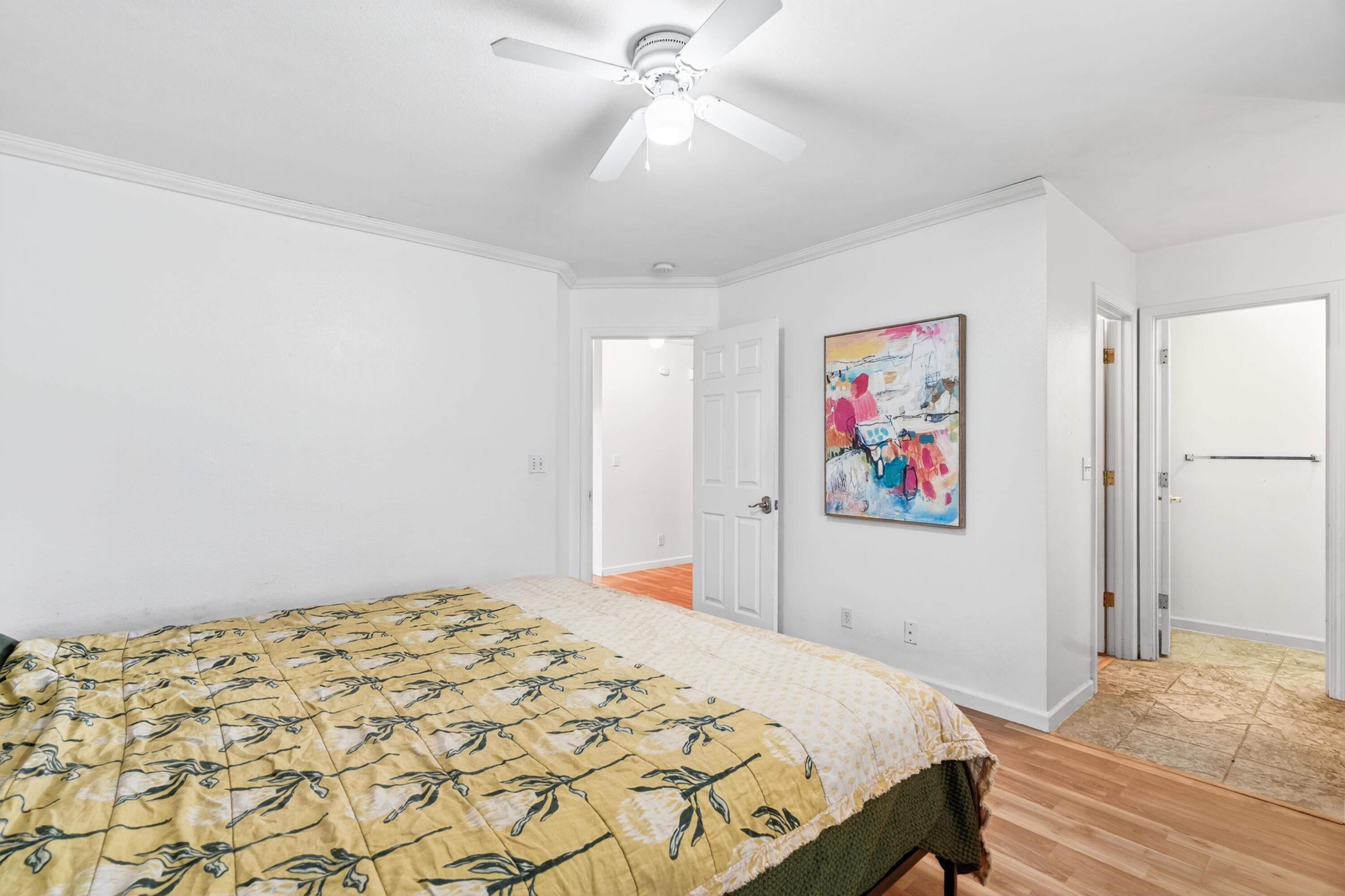 40 Ortega Court Redding, CA 96003 - Photo 15 of 29 a bedroom with a bed and a painting on the wall