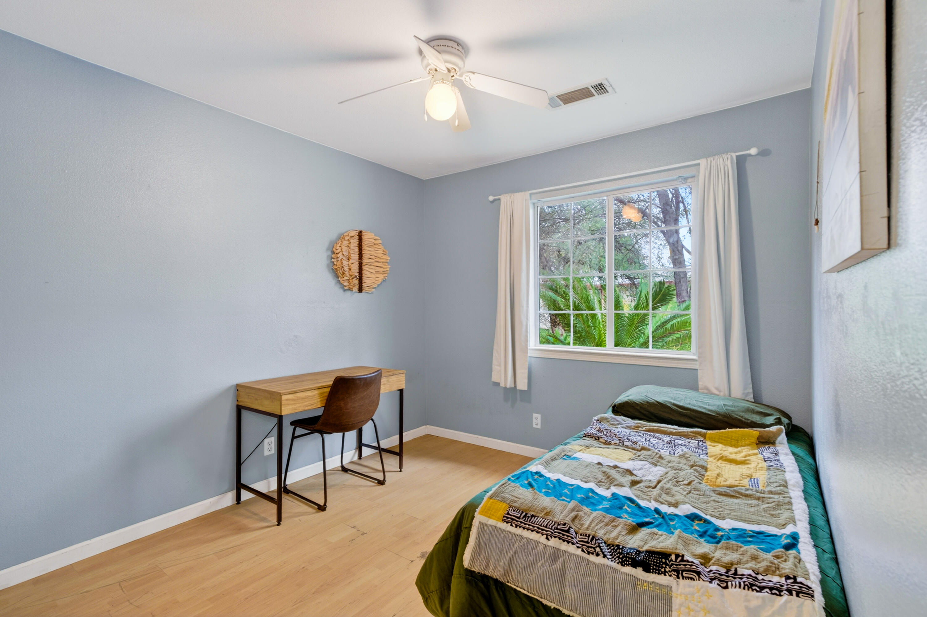 40 Ortega Court Redding, CA 96003 - Photo 18 of 29 a bedroom with a bed and a window