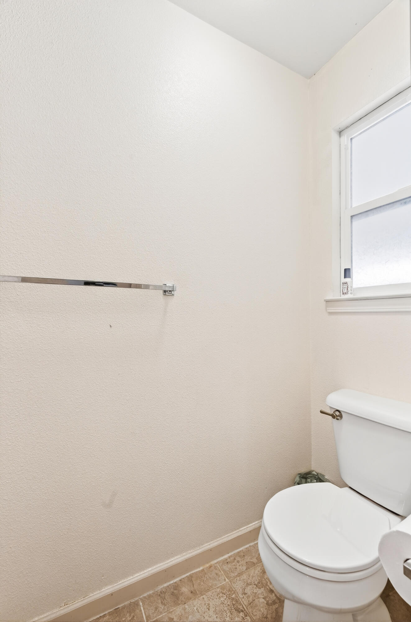 40 Ortega Court Redding, CA 96003 - Photo 22 of 29 a white toilet sitting next to a window