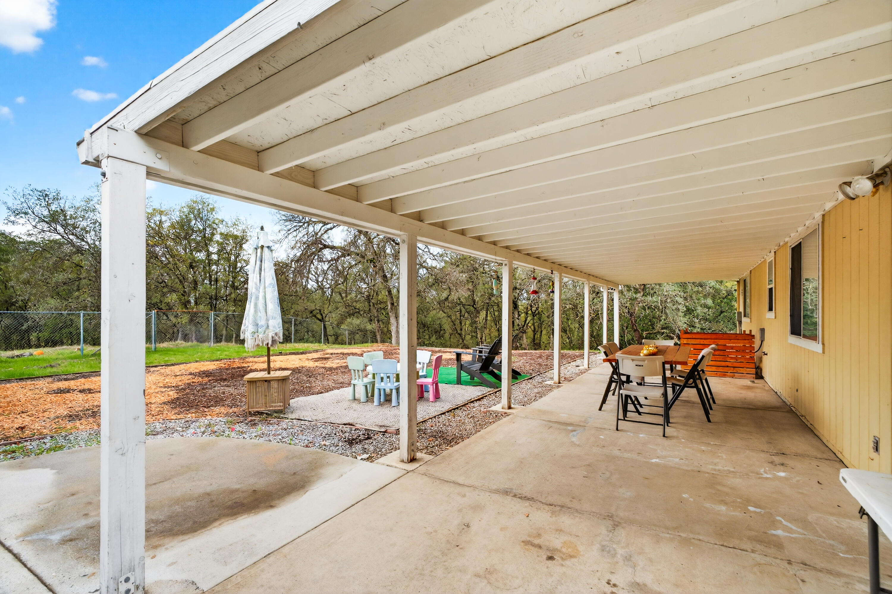 40 Ortega Court Redding, CA 96003 - Photo 24 of 29 a view of a patio with a table and chairs