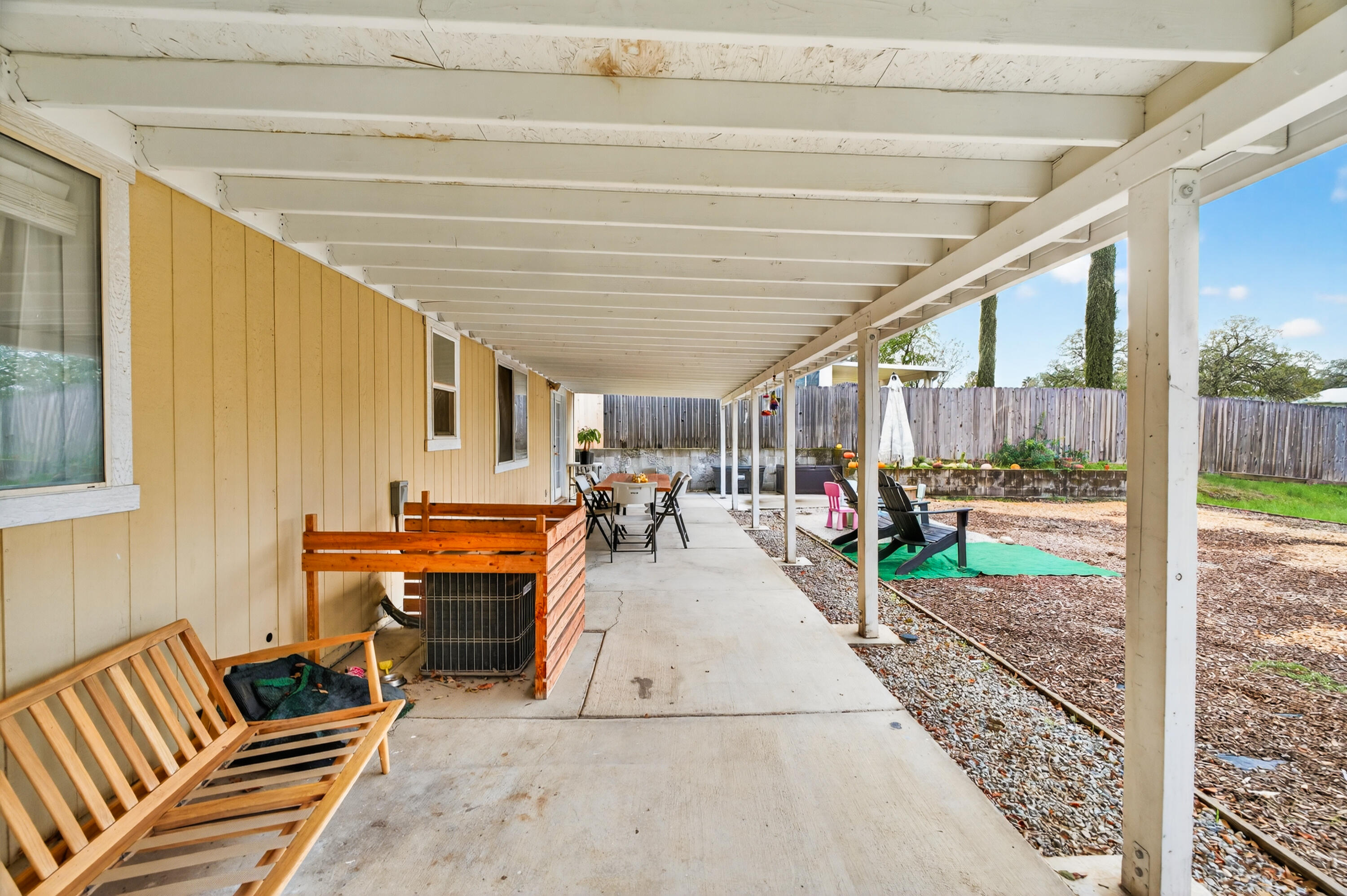 40 Ortega Court Redding, CA 96003 - Photo 25 of 29 a view of a patio with table and chairs a barbeque
