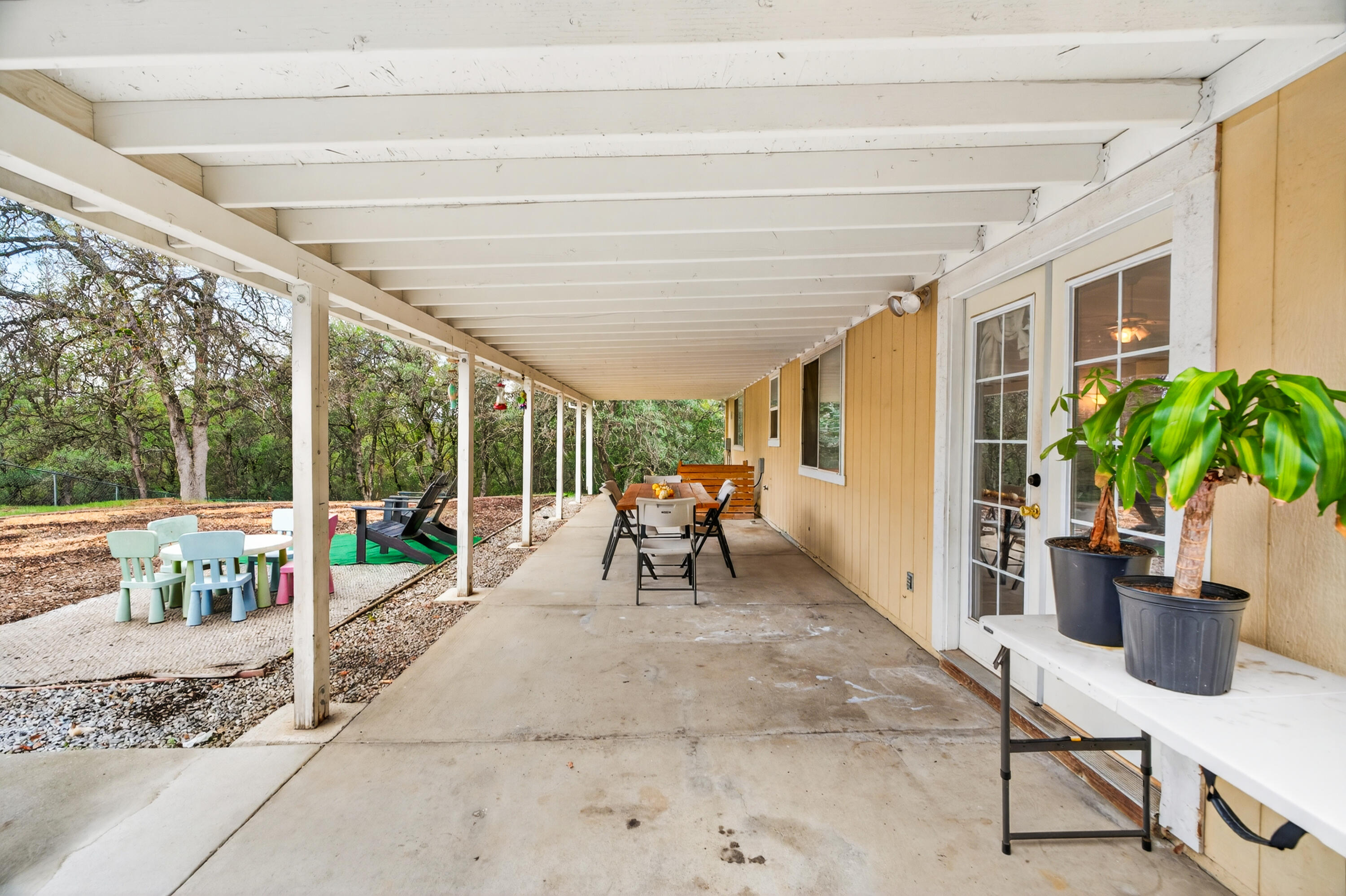 40 Ortega Court Redding, CA 96003 - Photo 26 of 29 a living room with furniture and a floor to ceiling window