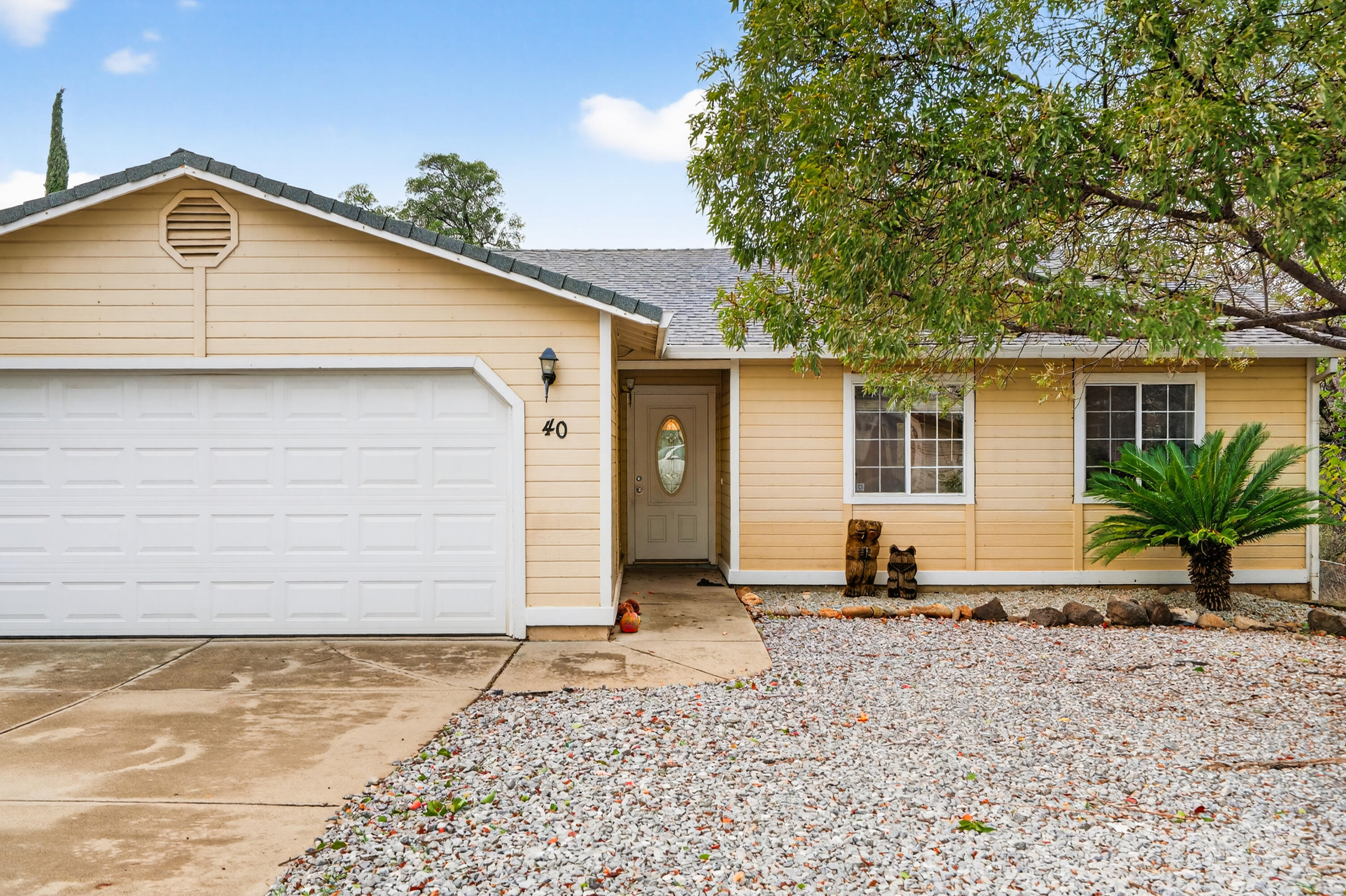 40 Ortega Court Redding, CA 96003 - Photo 3 of 29 a front view of a house with a yard