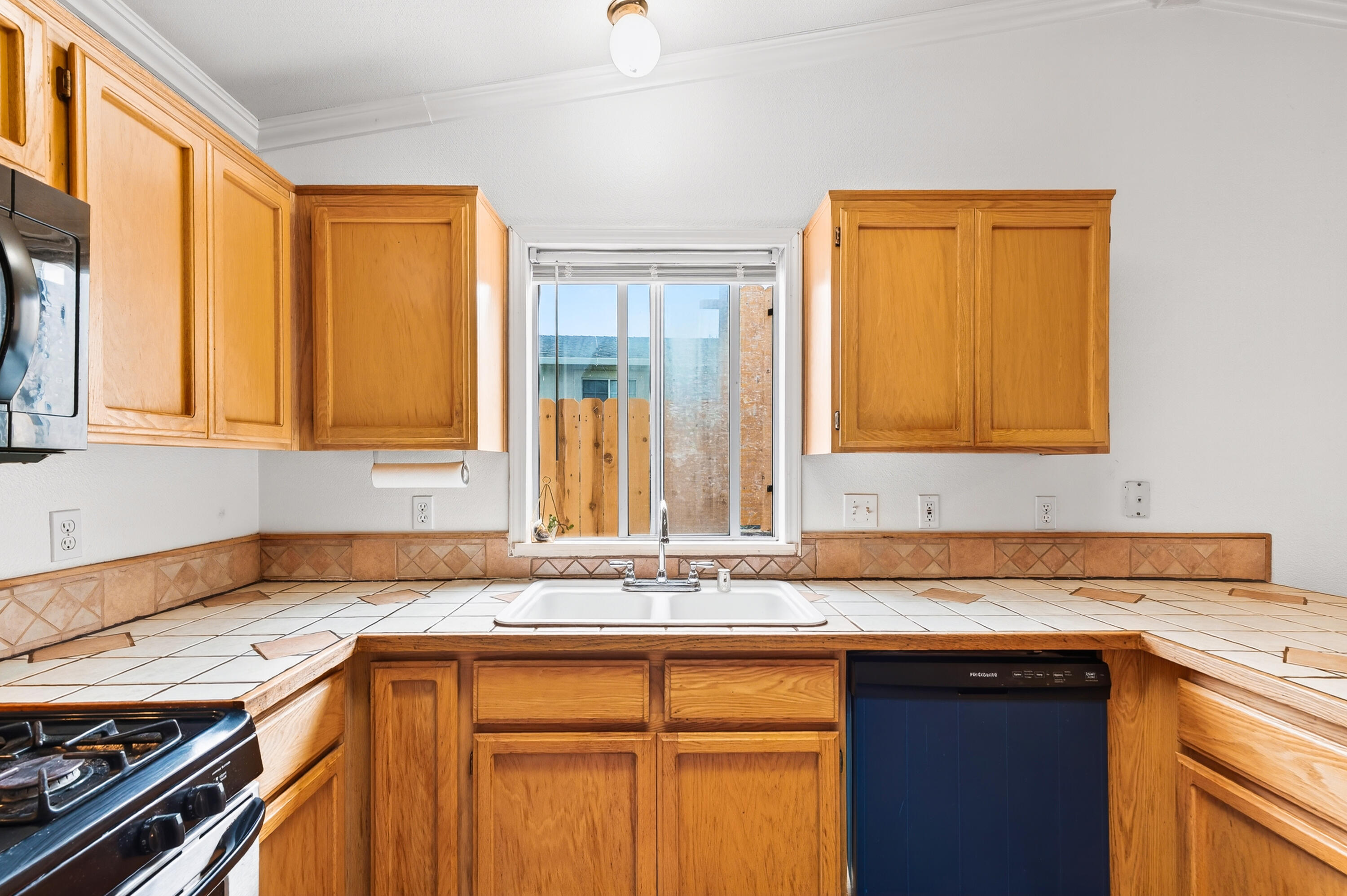 40 Ortega Court Redding, CA 96003 - Photo 9 of 29 a kitchen with stainless steel appliances granite countertop a sink stove and cabinets